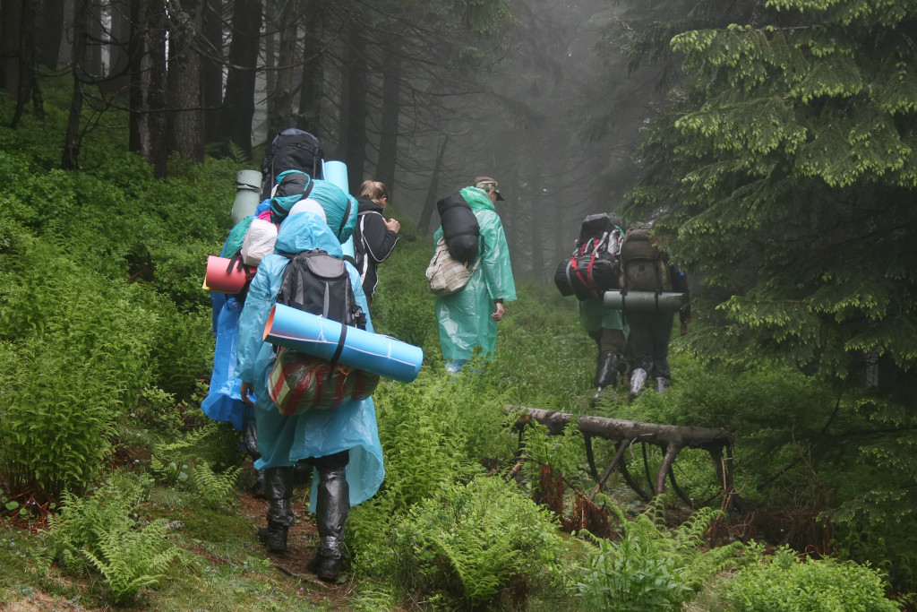 Hiking Tips - Plan for the weather and know the forecast - Group of hikers walking in mountains